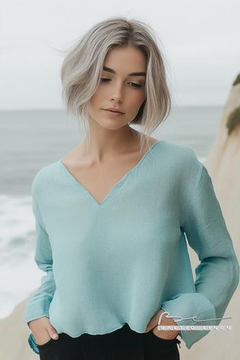 Stunning coastal fashion with asymmetrical bob and aqua oversized top
